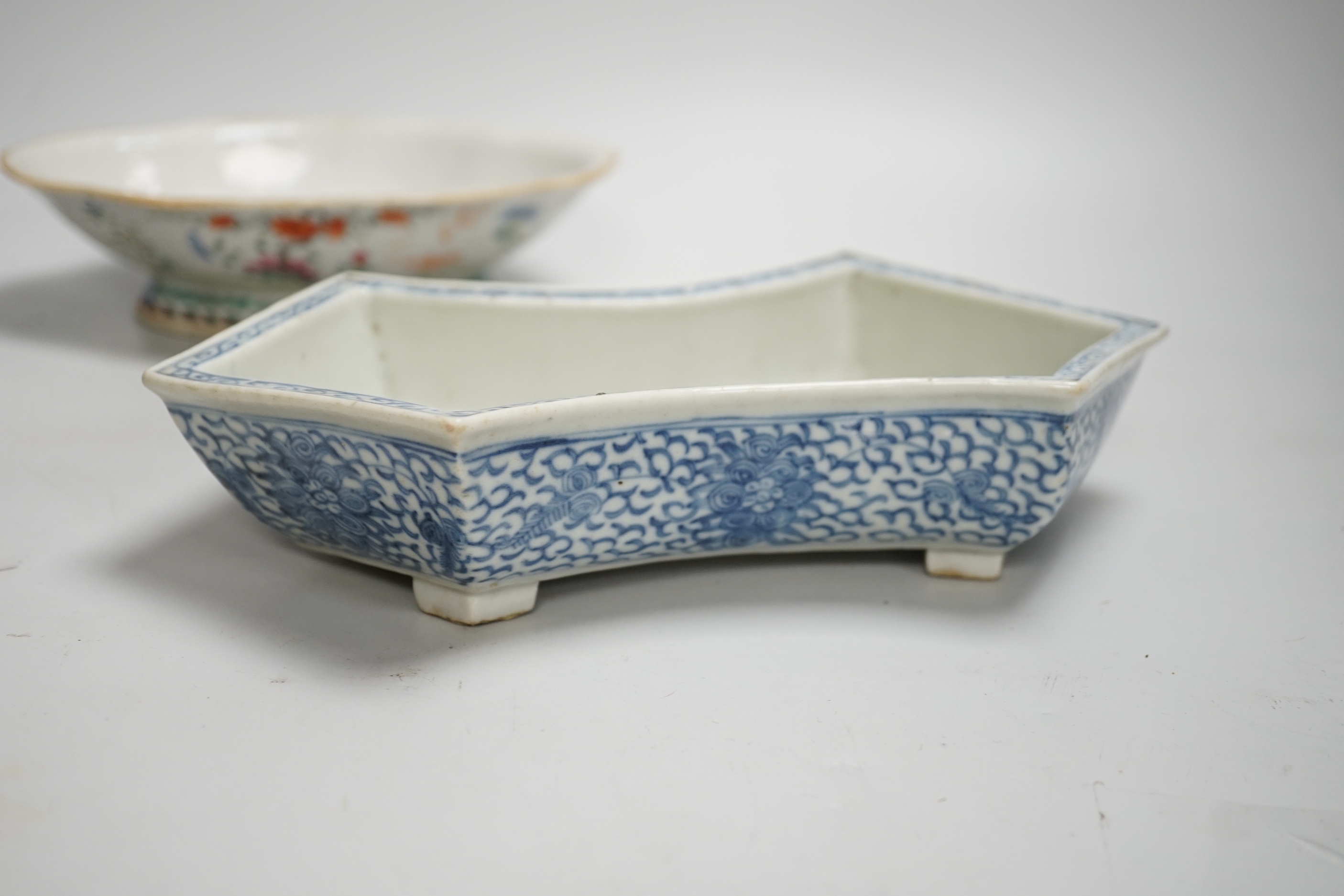 A 19th century Chinese blue and white ingot shaped dish and a famille rose footed dish, the largest 25cm wide (2)